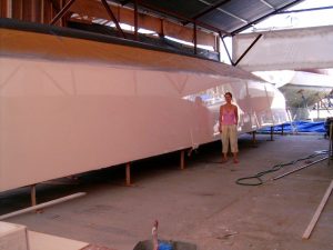 The 55' catamaran's hull, faired and sprayed