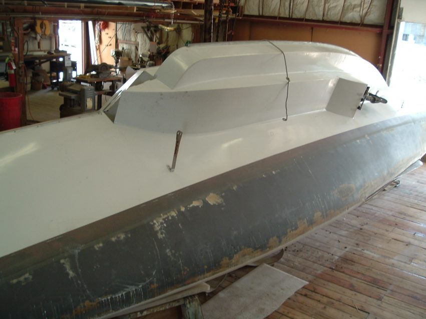 Photo A: ADAGIO's main hull tipped at an angle to make fairing the bottom easier.