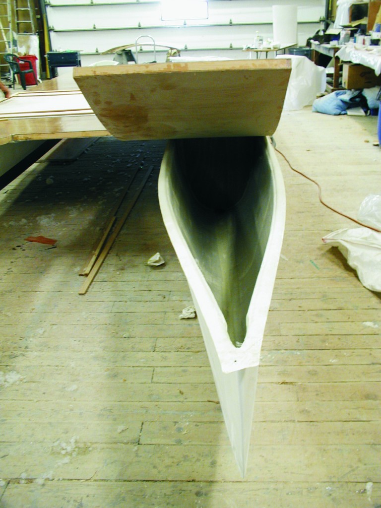 Magic Carpet before the bows are covered. The hulls are connected with an 8' 6" wide composite deck built of 1½" honeycomb core sandwiched between 3-ply okoume plywood. The flat deck curves up at the bow to form an anti-dive/wave deflector.