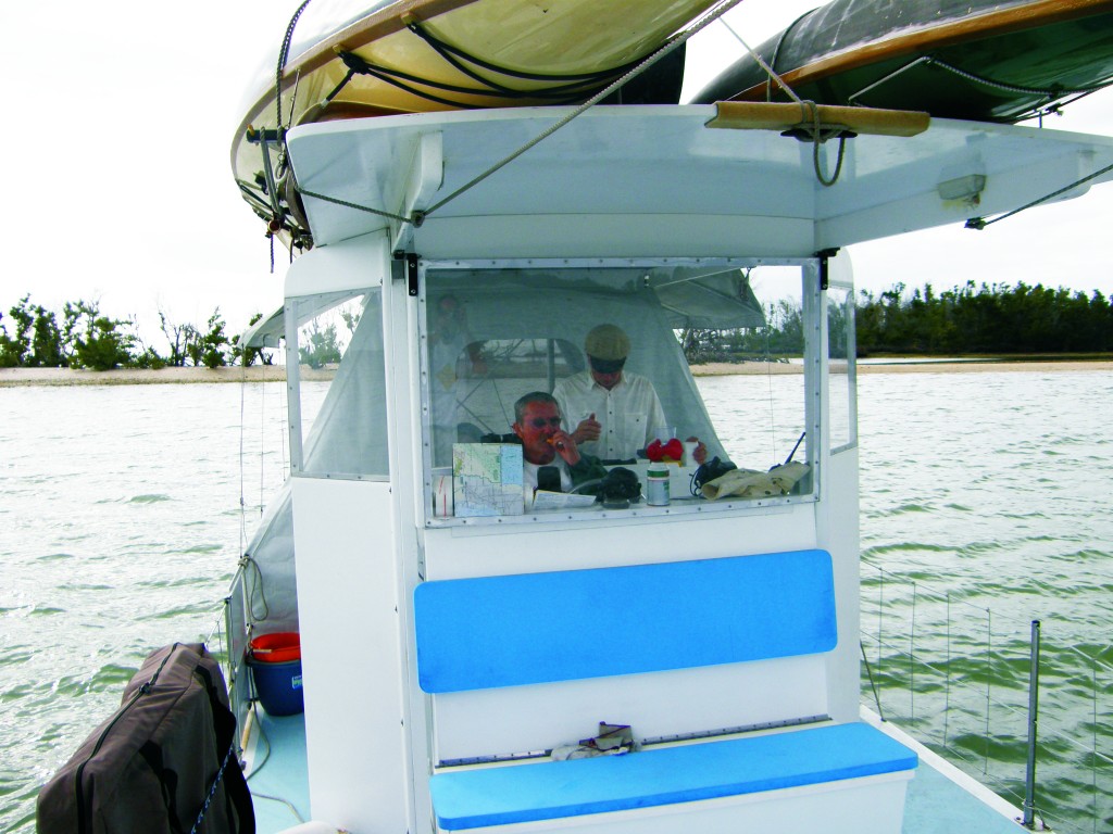 The three sailing canoes are stowed on racks mounted to the roof.