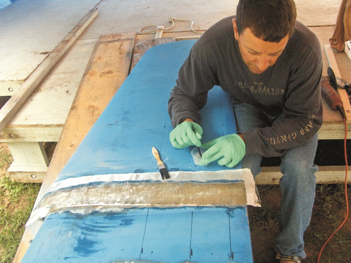 Emergency rudder repair with WEST SYSTEM Epoxy and fiberglass cloth.