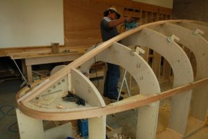 We planked the hull over a laminated Douglas fir stem, keelson, and sheer clamp.