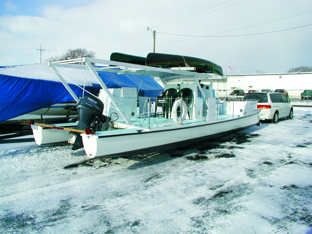 The fold-down roof is in the lowered position for travel.