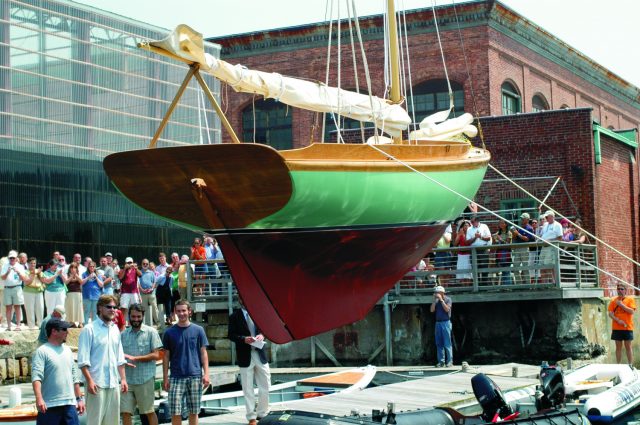 IRYS Students splash the Herreschoff 12.5 they restored during the school term on launch day. Photo courtesy of IYRS.