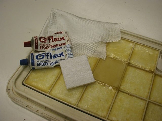 4. Glue low-density packaging foam (the white beady type) into the spaces between the ribs on the back side of the lid.