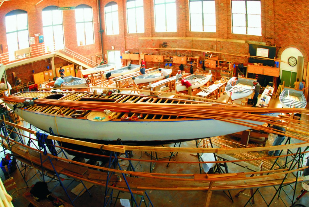 An overview of Restoration Hall, originally built in 1903 as an electricity plant. A 6-Metre restored by second-year IYRS students is in the foreground. Photo by Caitlin Wood