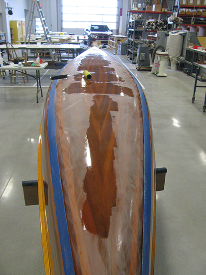 Localized coats of epoxy on a wood strip canoe