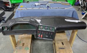 carbon skinning a racecar dashboard