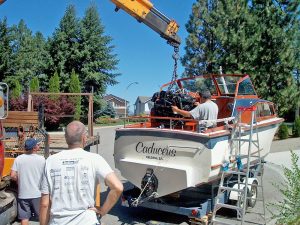 A crane placing a motor in the Caduceus